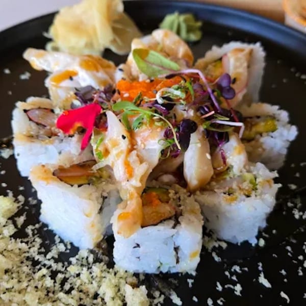 Lemongrass Asian Bistro sushi rolls with various toppings, including fish, roe, and microgreens.