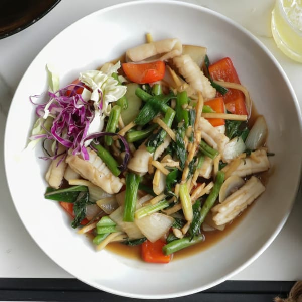 Lemongrass Asian Bistro's stir-fried squid with vegetables, including red bell peppers, onions, and green onions.